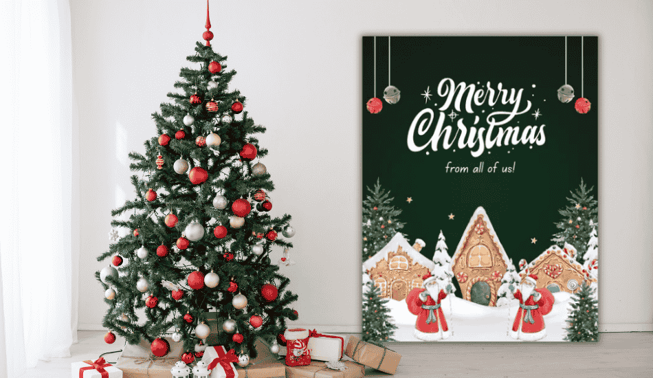 christmas tree and gingerbread houses card with merry christmas from all of us text.